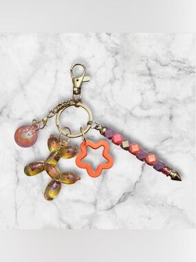 Iridescent Balloon Dog Keychain with Orange Star Charm